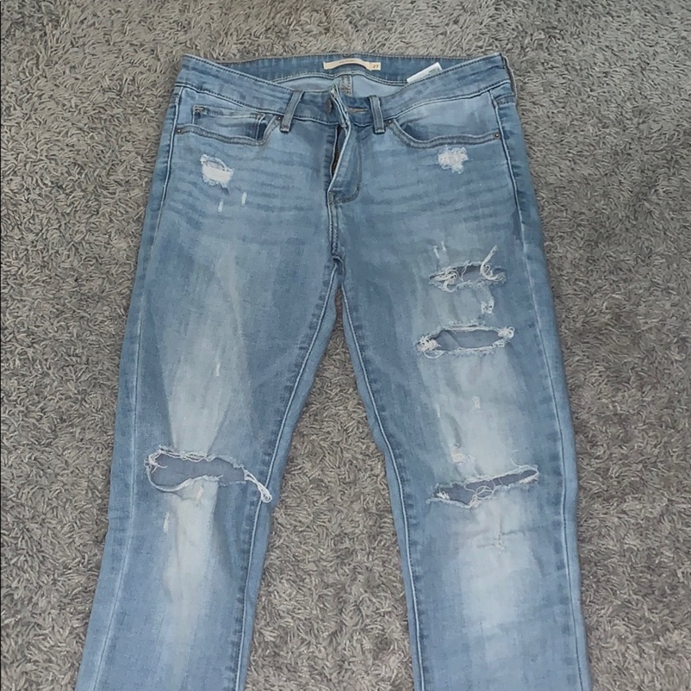 Levi’s 711 Skinny light wash ripped jeans